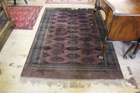 Bokhara design part silk camel ground rug(-)